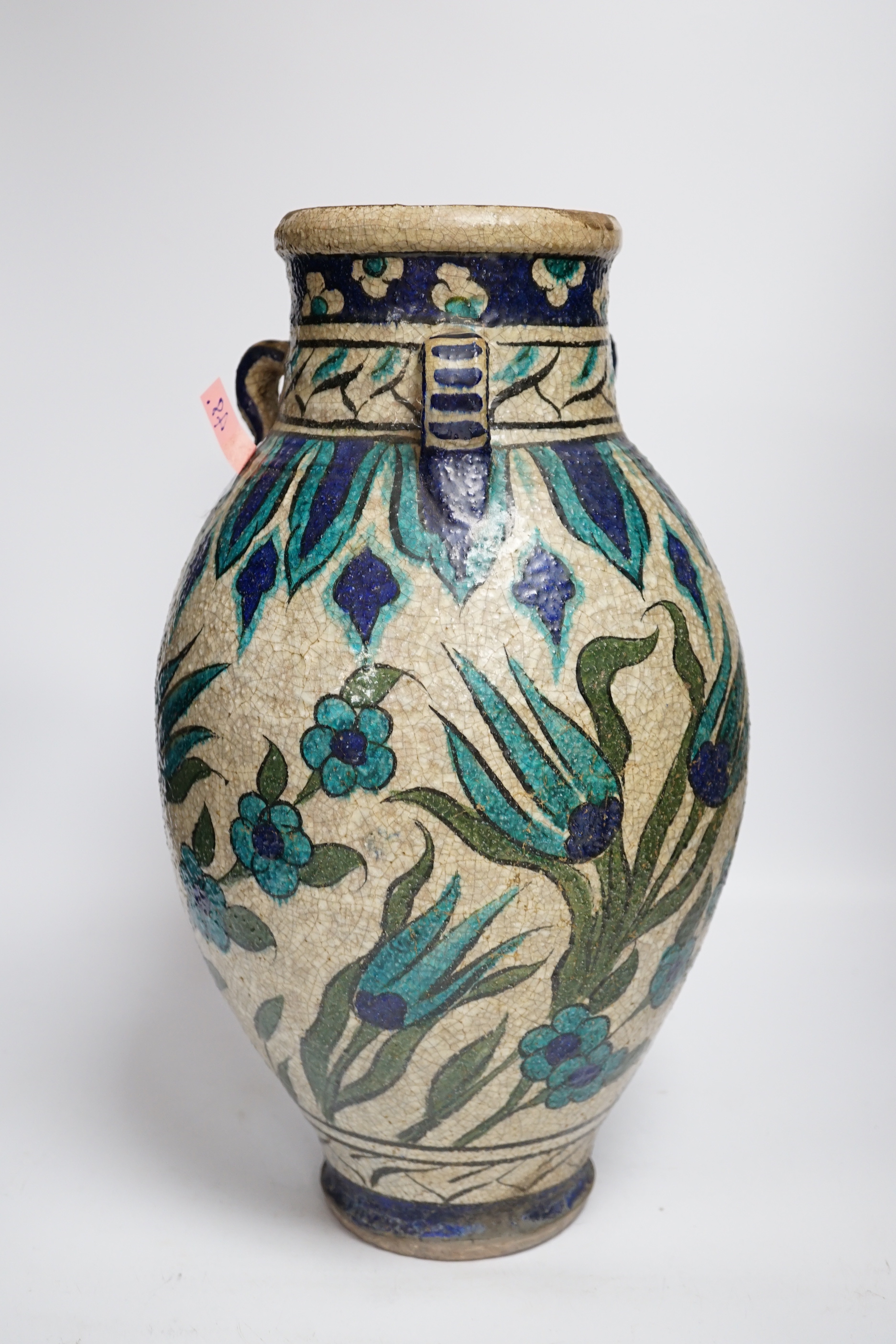 A Persian fritware vase in Iznik style, 40cm high